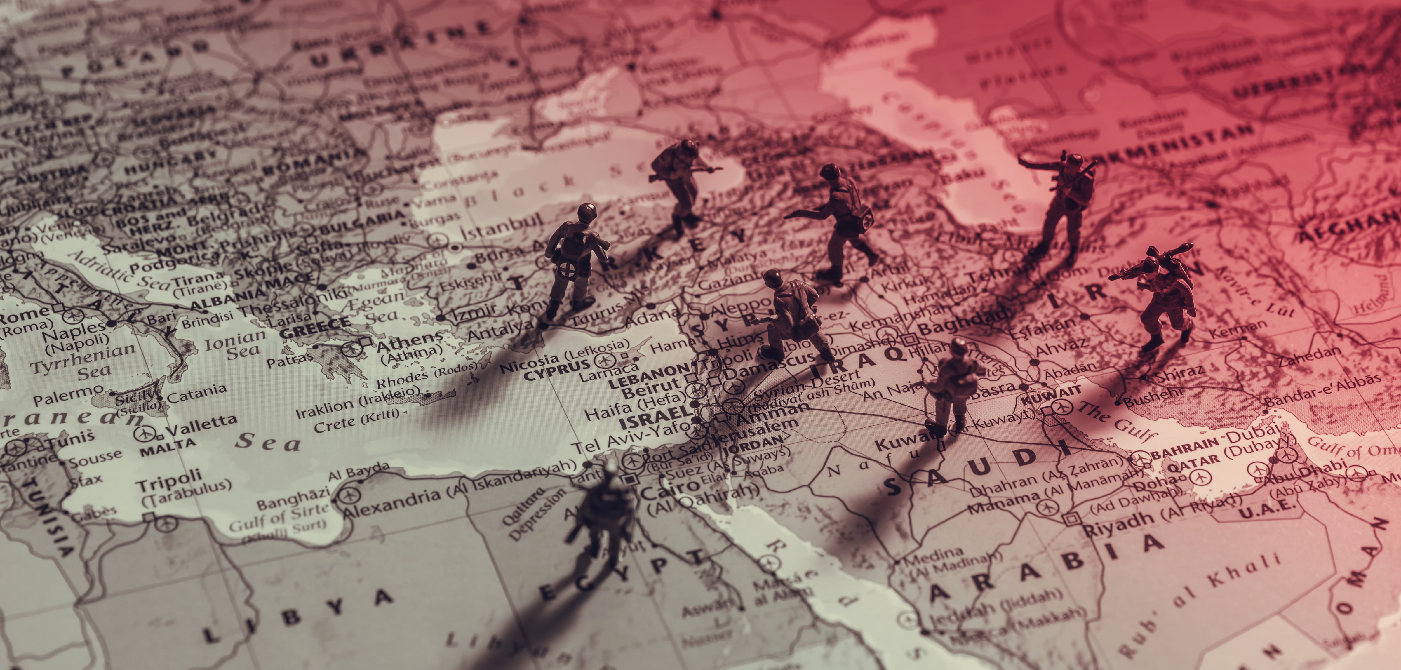 Toy soldiers over the map of Middle East countries: Iraq, Egypt, Saudi Arabia, Iran, and Turkey