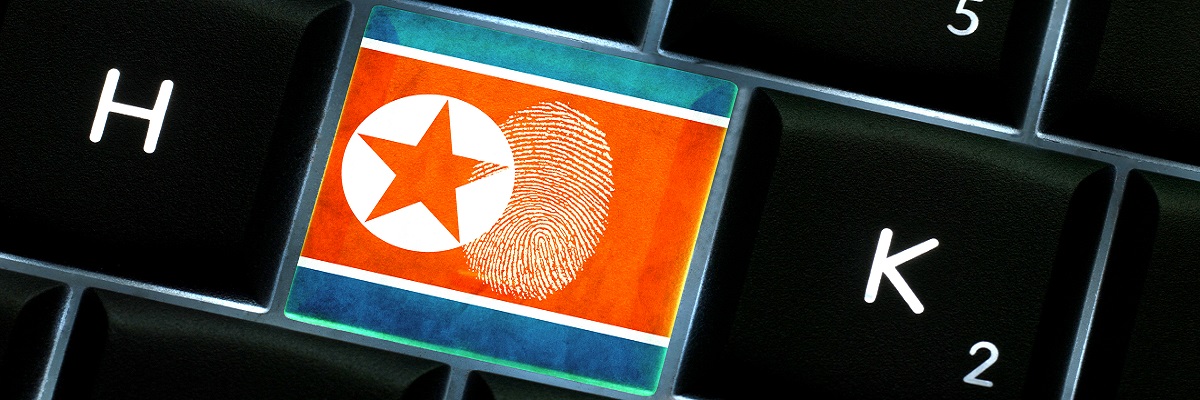 Online crime scene with a finger print left on backlit keyboard with North Korea flag on it