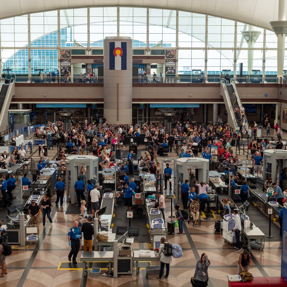 Denver, CO July 7, 2018: Large line of travelers backed up at security checkpoint at Denver International Airport