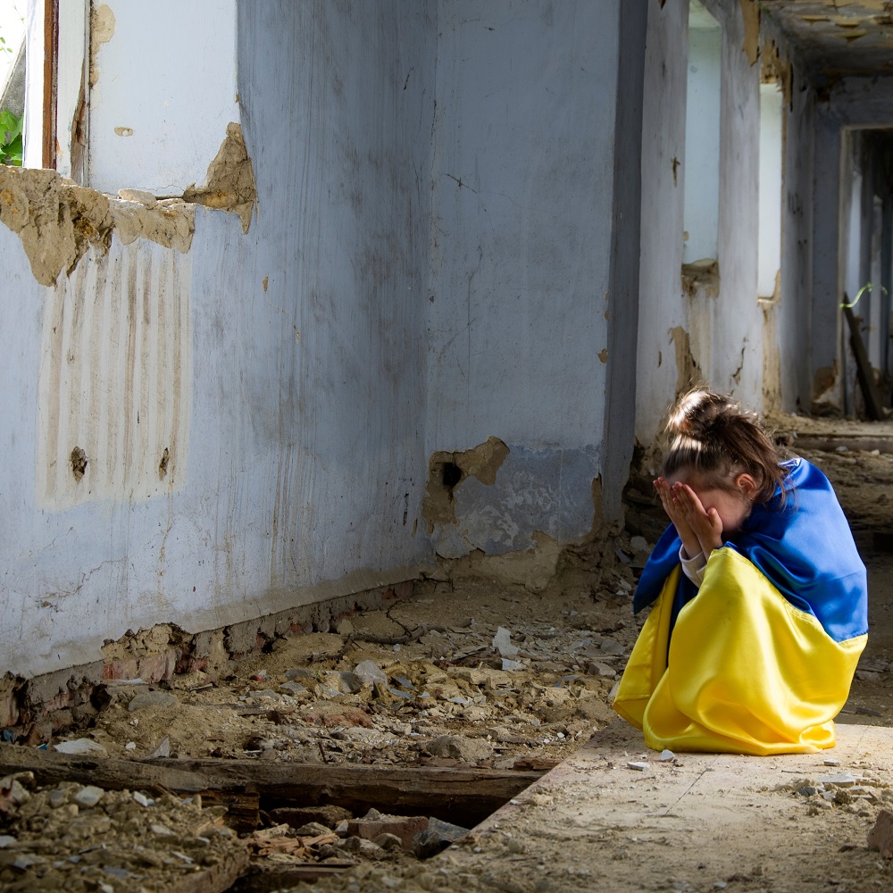 A child in a destroyed house. Ukrainian children during the war. 