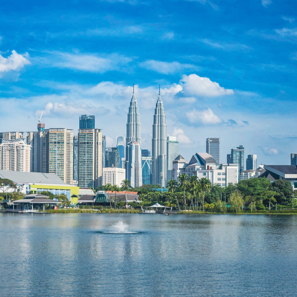 Skyscrapers of modern urban architecture and high-rise buildings with the Petronas twin towers, city centre of Kuala Lumpur.