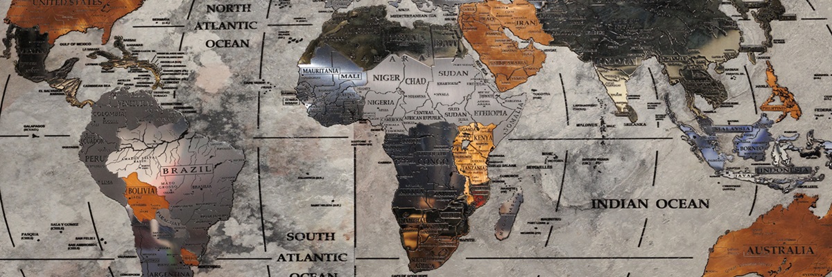 World geographic map made of metallic material with the African continent in the foreground.