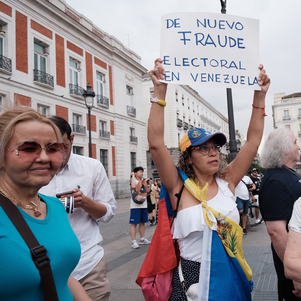 Several people during the demonstration against the results of the Venezuelan elections at sunset on July 29, 2024 in Madrid, Spain