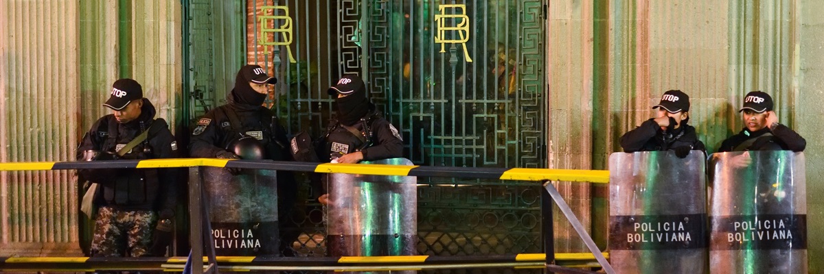 LA PAZ, BOLIVIA - JUNE 26, 2024: Bolivian National Police in Riot Gear Guarding Door of Presidential Palace after Failed Military Coup