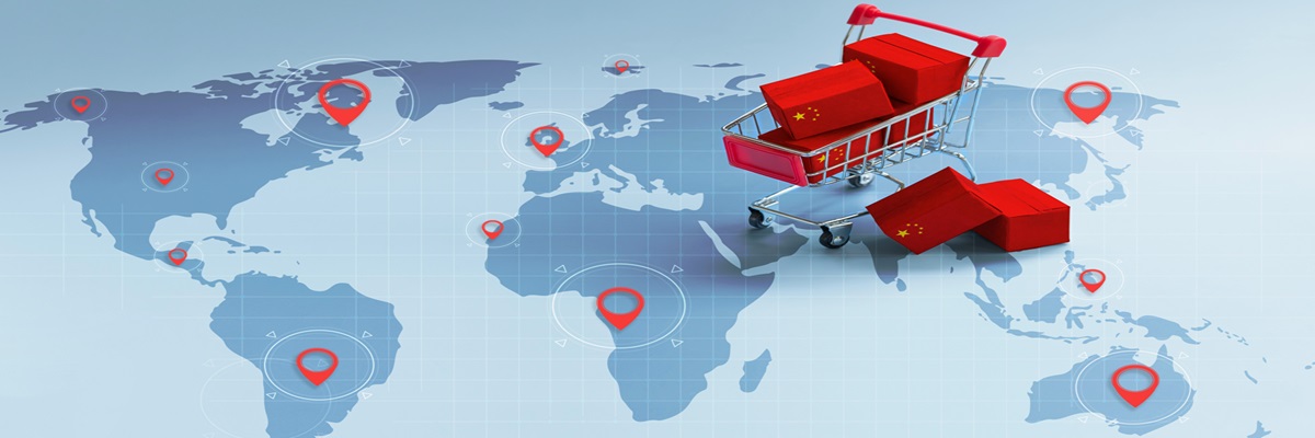 Packing and Shipping Boxes with the National flags of China on shopping carts with pin markings on the world map idea for expanding Chinese e-commerce's Rapid global growth.trade war. China economic