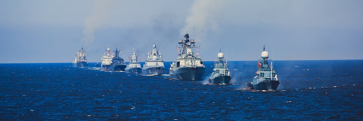 A line of modern russian military naval battleships warships in the row, northern fleet and baltic sea fleet in the open sea