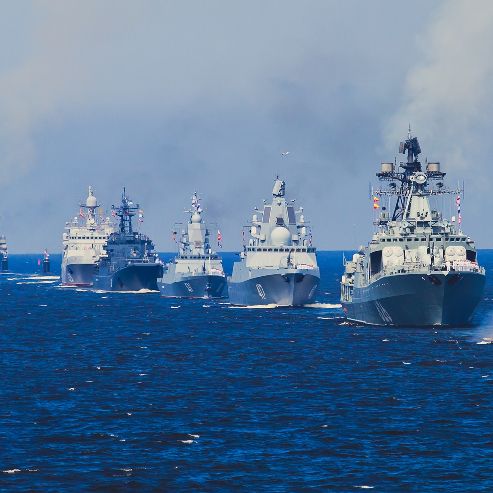 A line of modern russian military naval battleships warships in the row, northern fleet and baltic sea fleet in the open sea