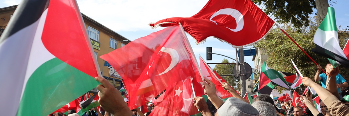 Istanbul, Turkey - 10 October 2023: Turkish people wave Turkish and Palestinian flags during a march in support of Palestine and Gaza. Protest against Israel.