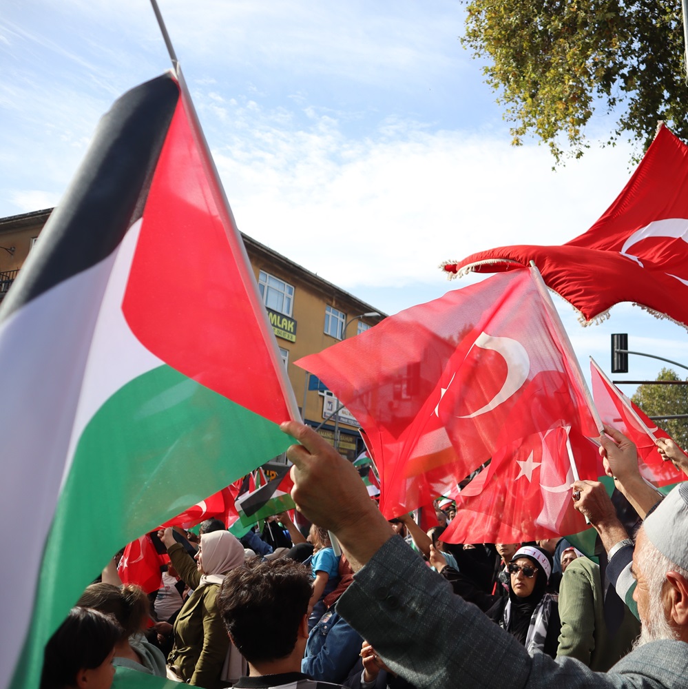 Istanbul, Turkey - 10 October 2023: Turkish people wave Turkish and Palestinian flags during a march in support of Palestine and Gaza. Protest against Israel.