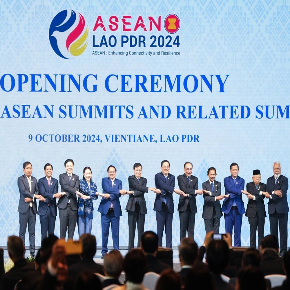 The leaders of the Association of Southeast Asian Nations (ASEAN) pose for a family picture doing the signature 