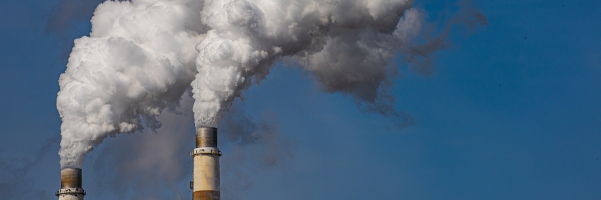 Exhaust stacks from coal fired power plant emitting waste products to atmosphere.