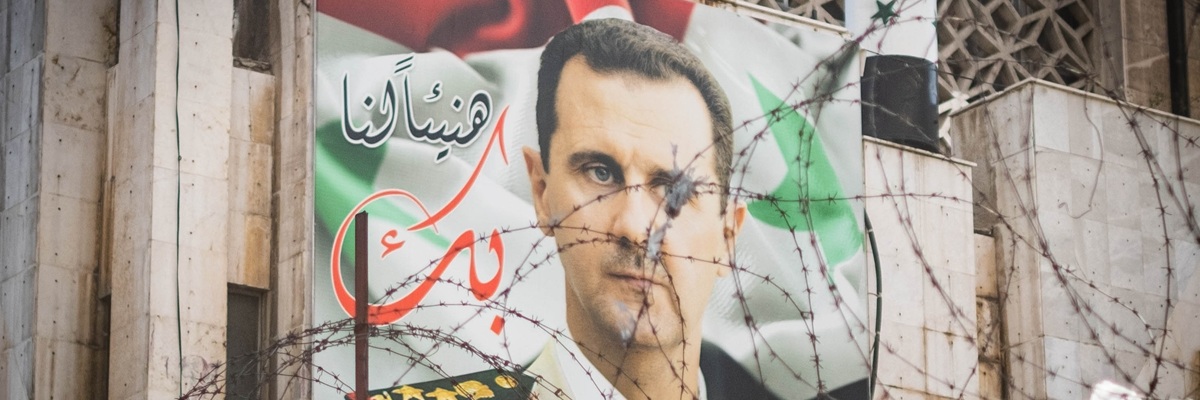 Damascus, Syria - May, 2023: Poster with Syrian President Bashar Al Assad on building facade