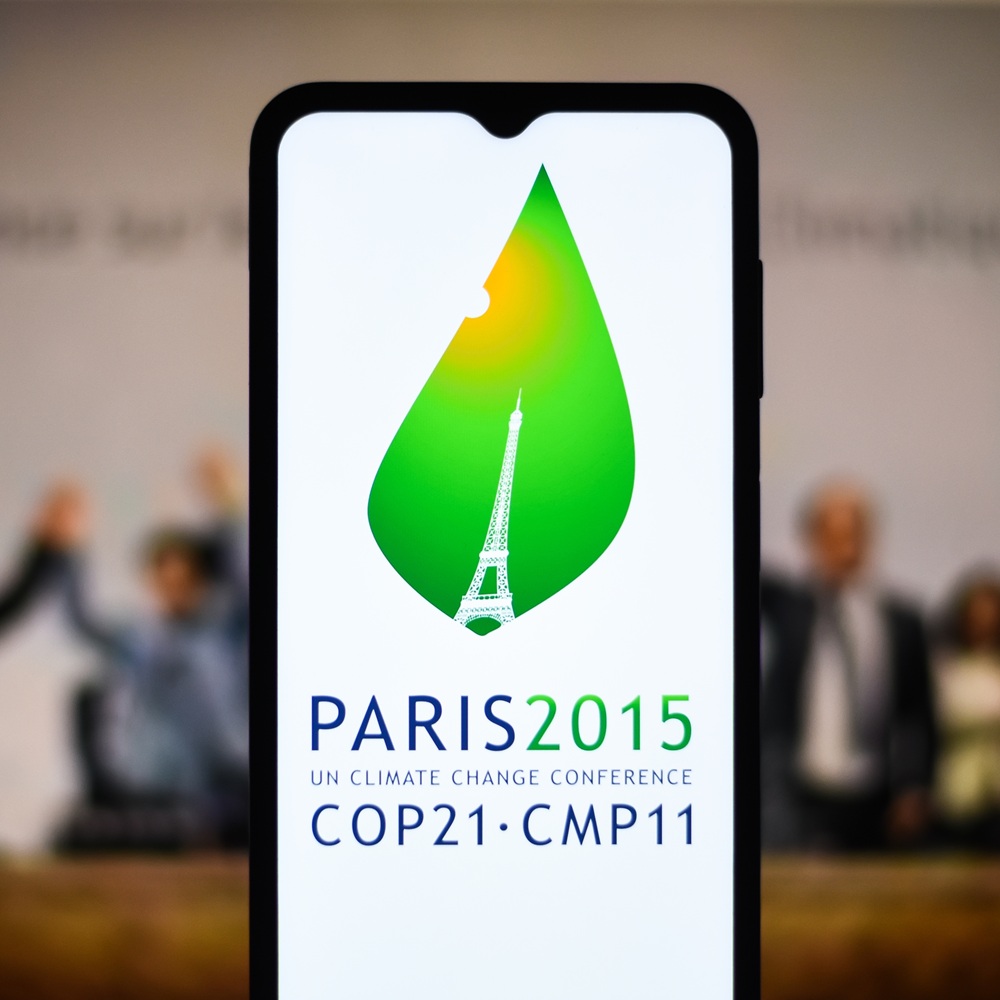 Selective focus of the 2015 United Nations Climate Change Conference, COP 21 or CMP 11 logo on a mobile screen stock image: Dhaka, BD- Feb 27, 2024