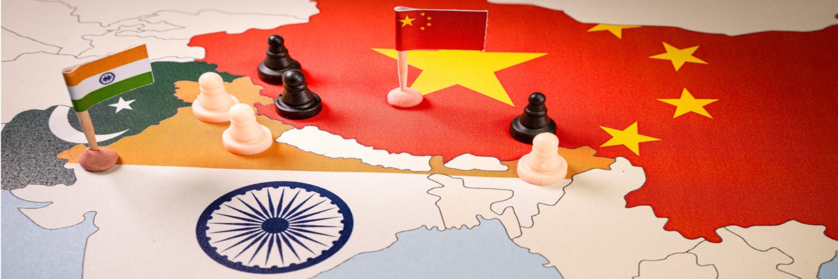 Chess pieces over a map of Idnia and China. India-China Border Dispute . Selective focus