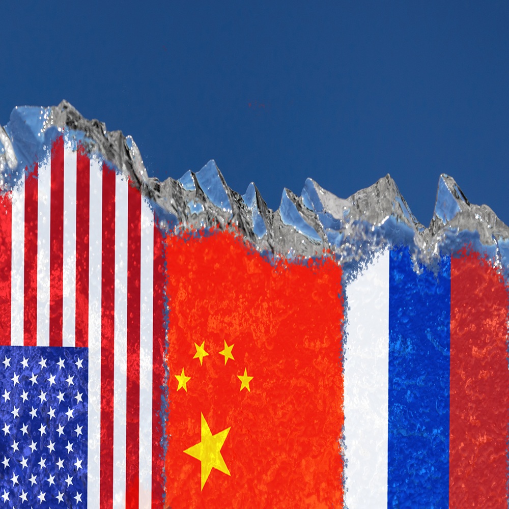 The flags of the Russia, United States, China and are drawn on a piece of ice in the form of an Arctic iceberg against a blue sky. Conflict of interests in the Arctic, Cold War, Arctic shelf