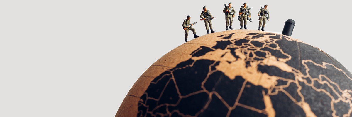 Group of soldiers on top of the earth globe. Military concept