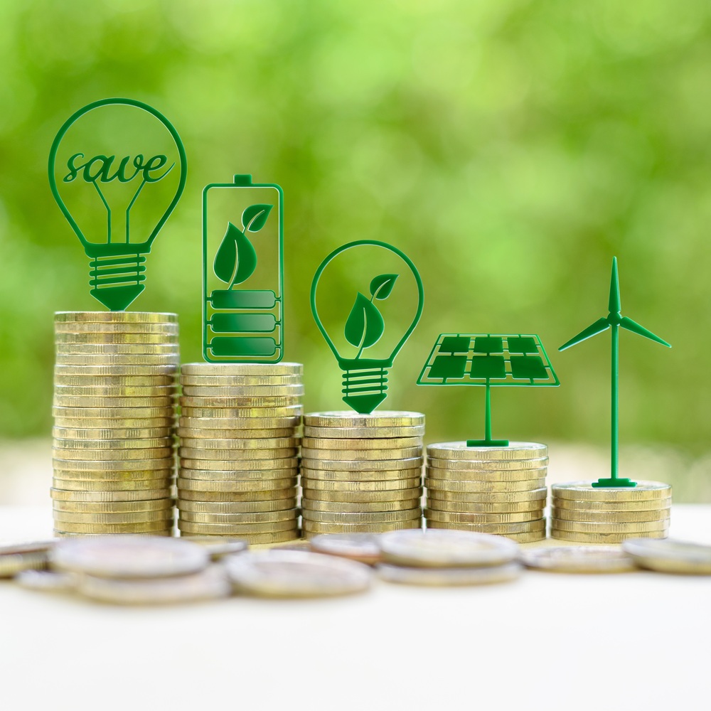 Alternative or renewable energy financing program, financial concept : Green eco-friendly or sustainable energy symbols atop five coin stacks e.g a light bulb, a rechargeable battery, solar cell panel