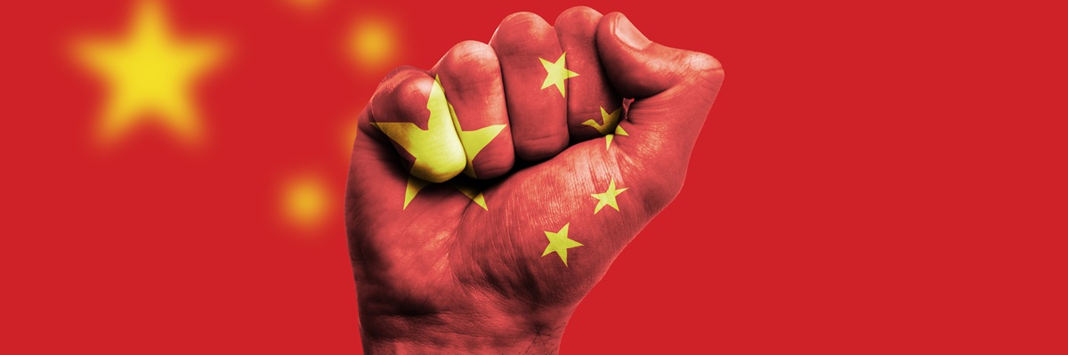 China flag painted on a clenched fist. Strength, Power, Protest concept
