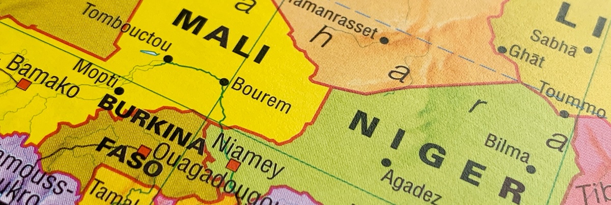 Mali, Niger, Burkina Faso, a photo of a world atlas map, suitable to illustrate travel, tourism, economy and politics topics