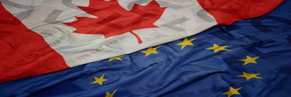 waving colorful flag of european union and flag of canada on a euro money banknotes background. finance concept. macro