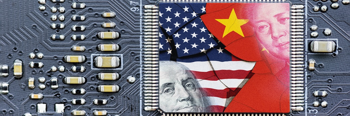 Flag of USA and China on a processor, CPU or GPU microchip on a motherboard. US companies have become the latest collateral damage in US - China tech war. US limits, restricts AI chips sales to China.