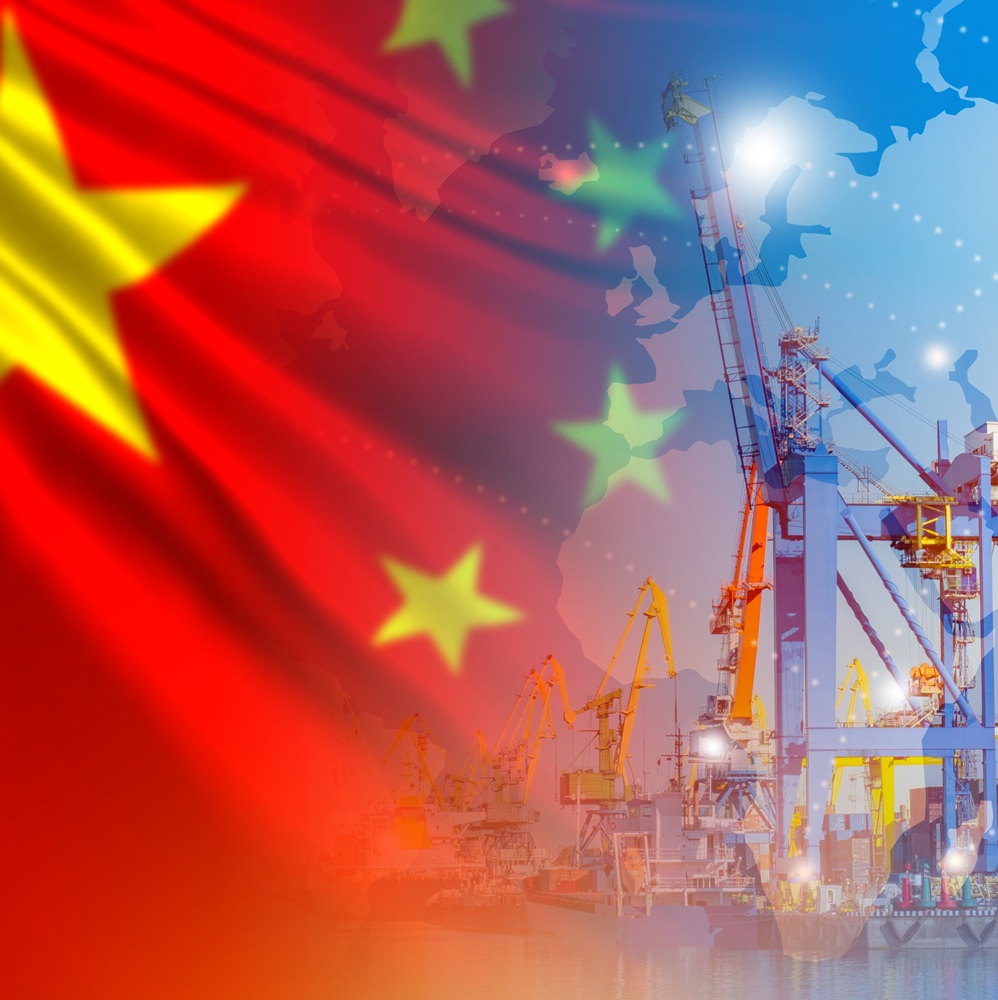 Chinese flag near port. Arrows of cranes from sea harbor. Deliveries to port of China. Deliveries of goods from PRC. Maritime logistics in China. Import of Chinese goods by sea. Export at China