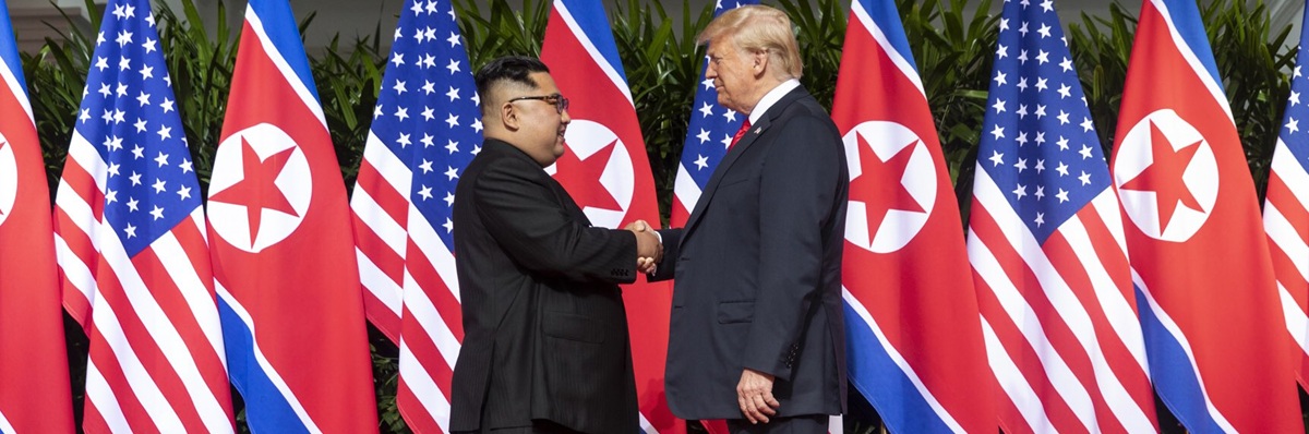 Kim and Trump shaking hands at the red carpet during the DPRK–USA Singapore Summit 2018