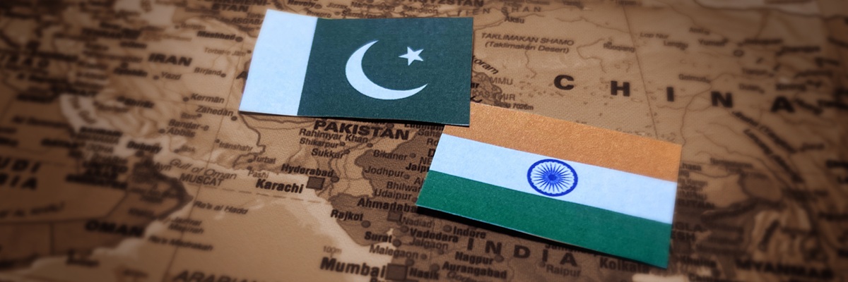 India vs Pakistan conflict concept background with flags and map in the backdrop. Political, war, trade, India pakistan sports