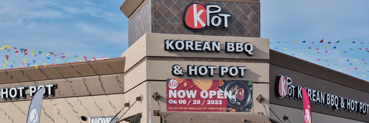 Houston, Texas USA 07-04-2023: KPOT Korean BBQ and Hot Pot storefront exterior in Houston, TX. National Korean cuisine restaurant chain.
