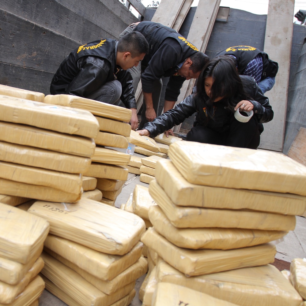 Lima, Peru - August 12, 2012: Seizure of drug or cocaine cargo in a truck with international destination. Packages filled with cocaine and the fight against drug trafficking.