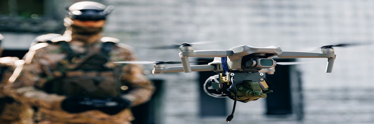 Soldier UAV operator launches army drone with bomb to drop into enemy fortifications and trenches. Concept using military robots in modern warfare.