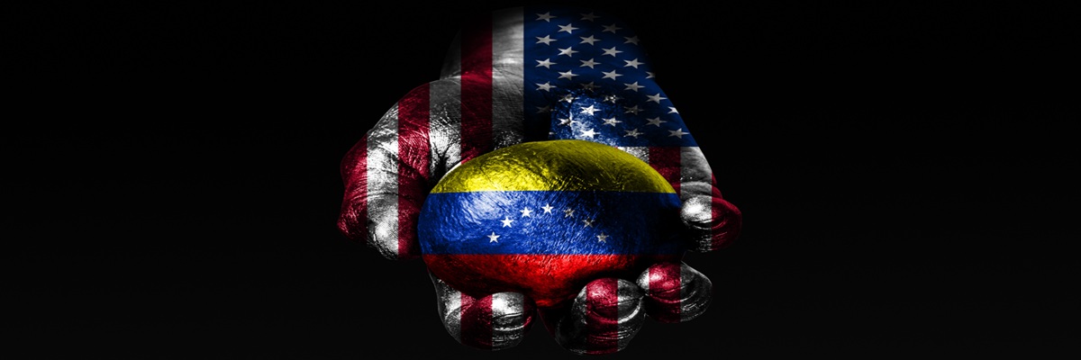A hand with a drawn USA flag holds a ball with a drawn Venezuela flag, a sign of influence, pressure or conservation and protection. Horizontal frame