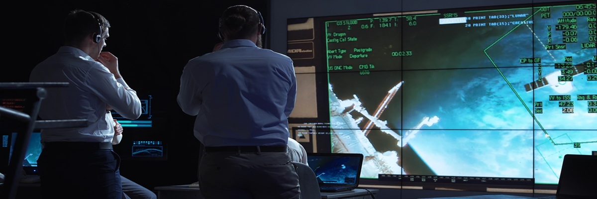 A group of people are controlling the orbiting international space station ISS. Elements of this image furnished by NASA.