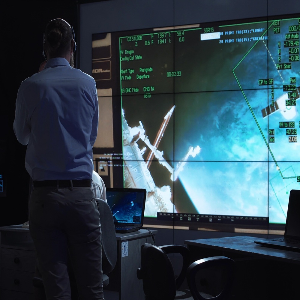 A group of people are controlling the orbiting international space station ISS. Elements of this image furnished by NASA.