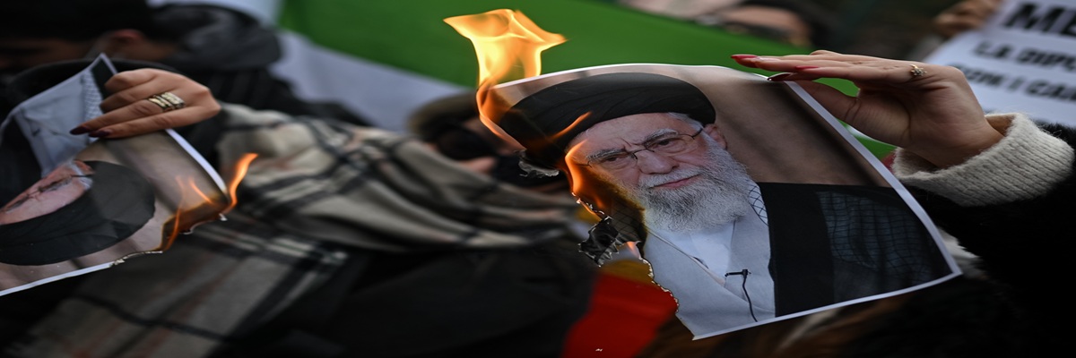 Milan, Italy - January 17, 2026: People burn a photo depicting Ali Khamenei, Supreme Leader of Iran during a demonstration in solidarity with Iranian protestors 