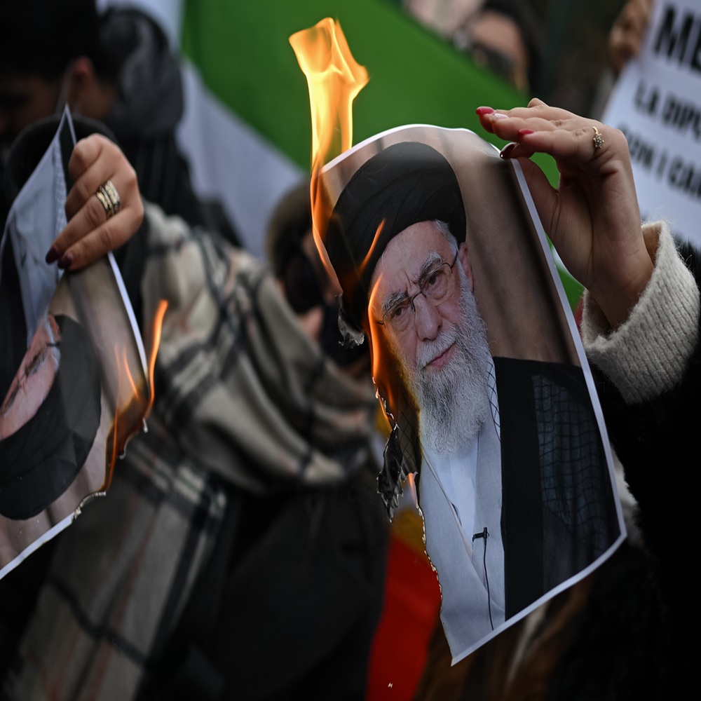 Milan, Italy - January 17, 2026: People burn a photo depicting Ali Khamenei, Supreme Leader of Iran during a demonstration in solidarity with Iranian protestors 